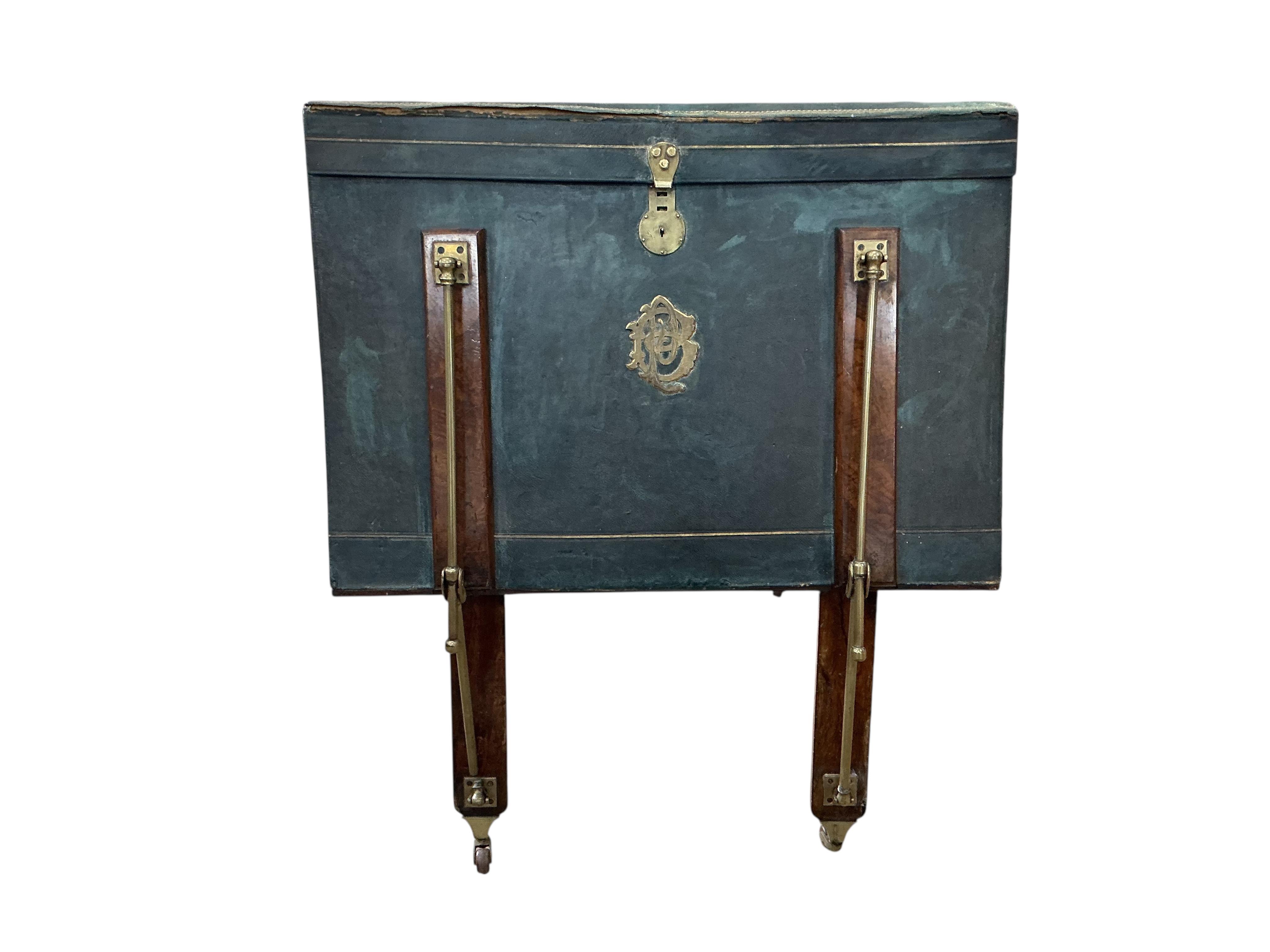 A Victorian brass mounted green morocco folio stand, width 82cm, height 90cm